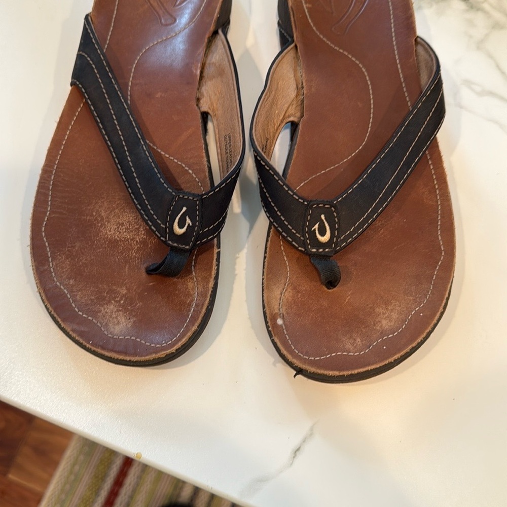 OluKai Brown and Black Women's Sandals